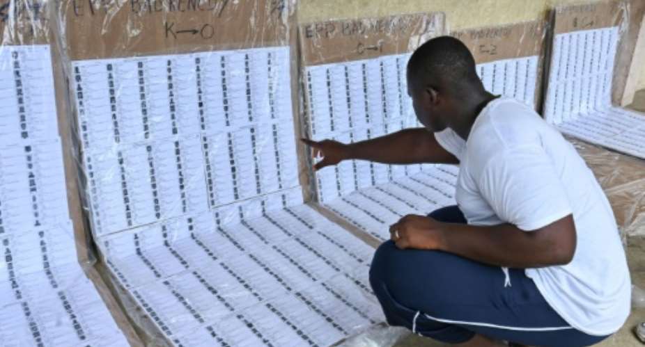 A voter checks for his name on the voters roll in the Abidjan suburb of Abobo.  By Issouf SANOGO (AFP)