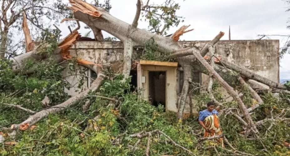A woman inspects the damage caused by Cyclone Kenneth to her home in Macomia, in the north of Mozambique.  By Emidio Jozine AFP
