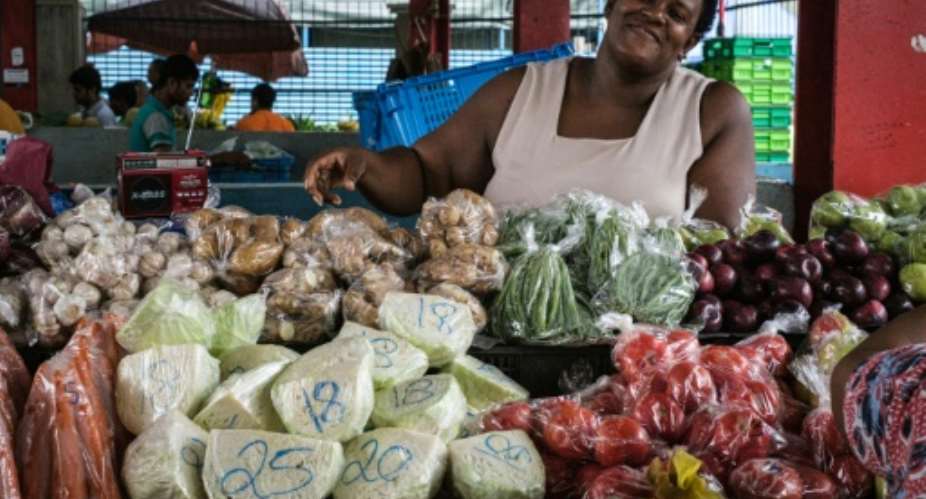 A woman sells vegetables, mostly imported from South Africa, in 2019 at a market in Victoria on Mahe island, Seychelles.  By Yasuyoshi CHIBA AFPFile