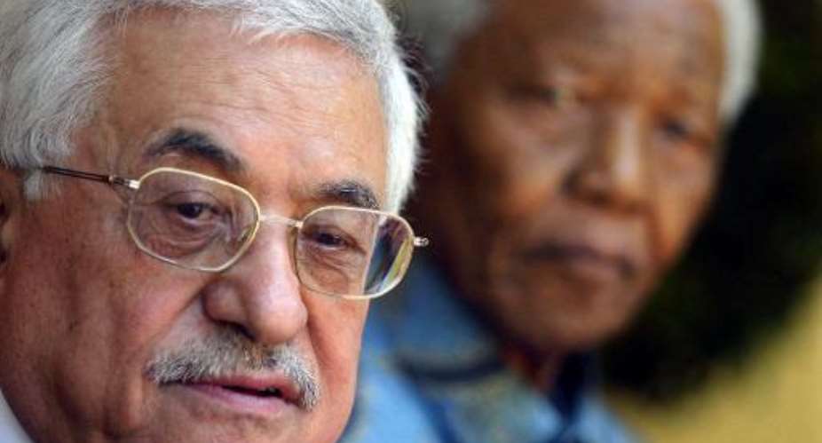 Palestinian Authority President Mahmoud Abbas and the former South African President Nelson Mandela are pictured at Mandela's house in Johannesburg April 1, 2006.  By Fati Moalusi AFPFile