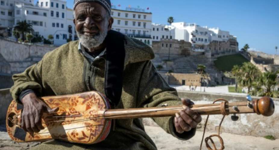 Abdellah El Gourd, a legend of gnawa, in the Moroccan city of Tangiers which will host 2024's International Jazz Day.  By FADEL SENNA AFP