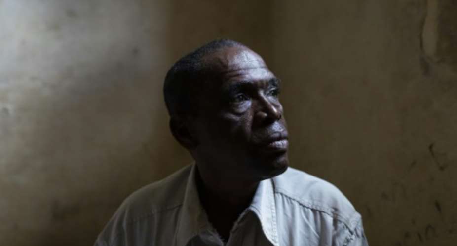 Abdoul Aziz Balde received news that the boat his son was on sank but has never seen his body.  By PATRICK MEINHARDT (AFP)