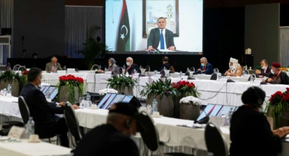 Abdul Hamid Mohammed Dbeibah delivers a speech via video link during a meeting of the Libyan Political Dialogue Forum.  By Handout UNITED NATIONSAFP