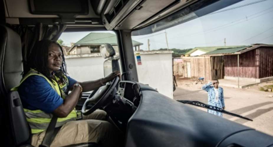 Abigail Asumadu-Amoah pictured is one of the 21 lorry drivers on the all-women team at Ghana's Ladybird Logistics.  By CRISTINA ALDEHUELA AFP