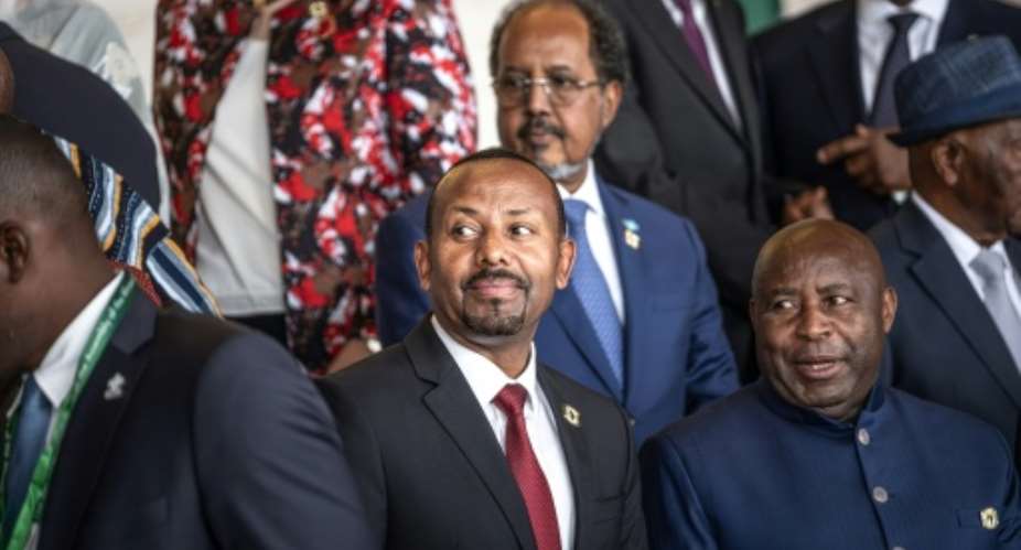 Abiy Ahmed (C), prime minister since 2018, is tipped to retain power in Mays general election.  By Marco Simoncelli (AFP)