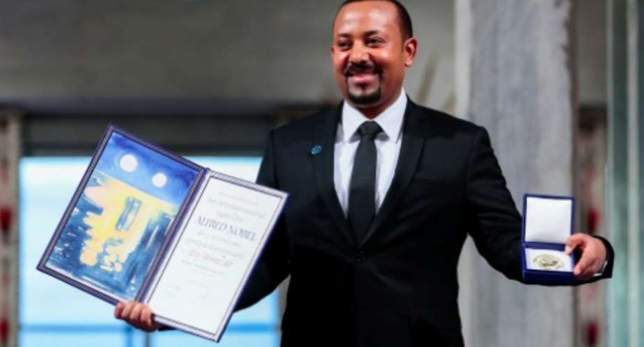 Abiy shows his Nobel at the award ceremonies in Oslo on December 10, 2019.  By Hkon Mosvold Larsen NTBAFPFile
