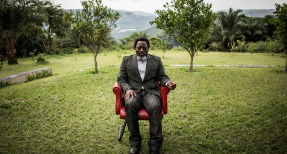 Accused: Former president Joseph Kabila, pictured at his ranch outside Kinshasa in December 2018.  By John WESSELS AFP