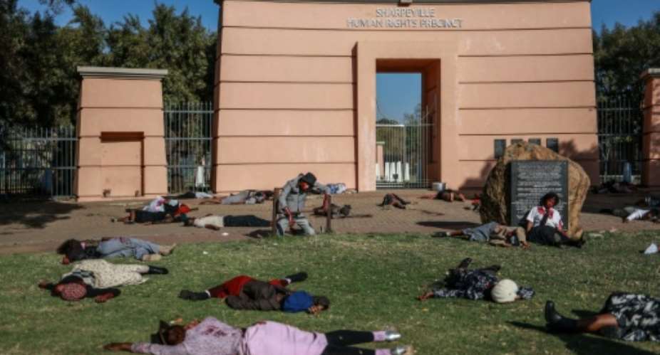 Activists staged a reenactment of the Sharpeville Massacre.  By PHILL MAGAKOE (AFP)