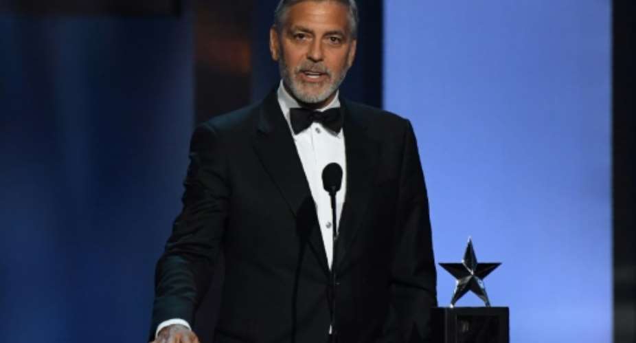Actor and activist George Clooney, seen here in 2018, says that the toppling of Sudan's veteran leader Omar al-Bashir is not sufficient.  By VALERIE MACON AFPFile