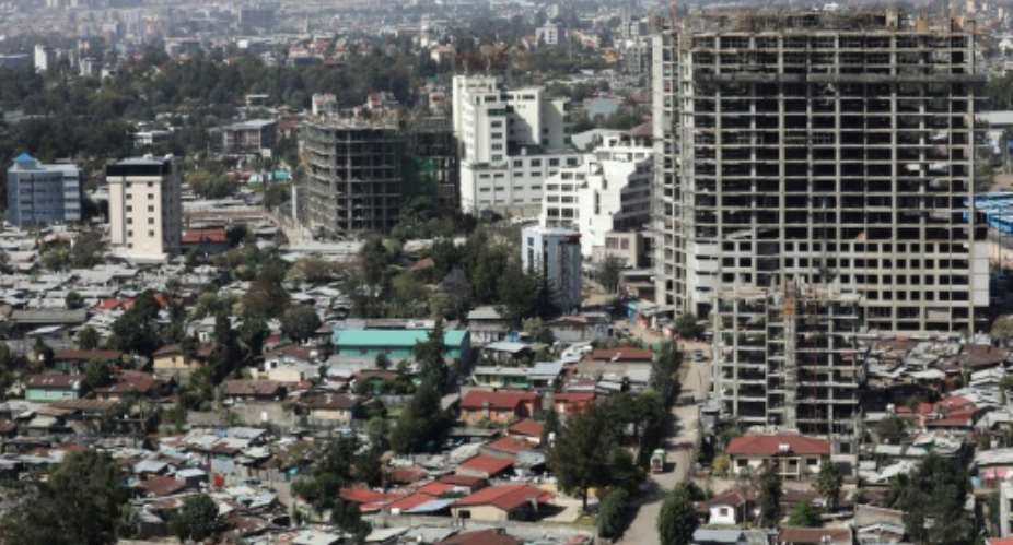 Addis Ababa has become a bustling, fast-changing city where modern buildings have shot up, construction is ever-present and greenery scarce.  By Ludovic MARIN AFP