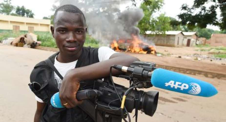 Agence France-Presse video and photo freelancer Pacome Pabandji poses in Bangui on April 27, 2104.  By Issouf Sanogo AFPFile