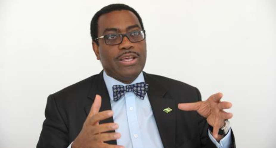 Nigerian Agriculture Minister and candidate for next president of the African Development Bank, Akinwumi Adesina, talks to the media in Paris on March 25, 2015.  By Eric Piermont AFPFile