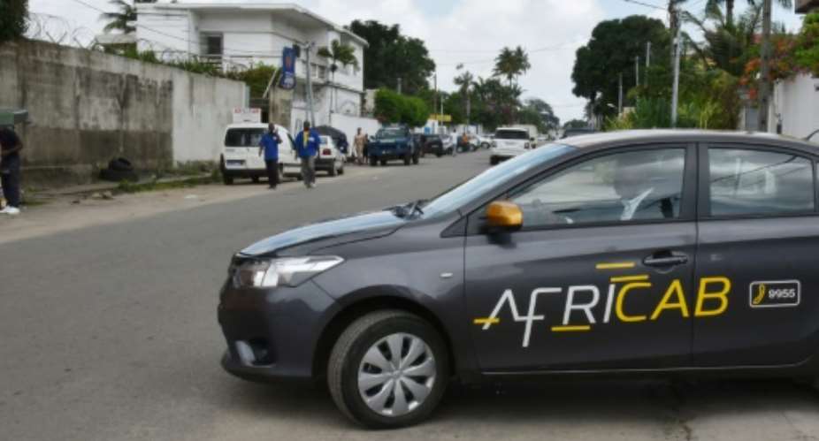 Africab clients can use the firm's app to book its taxis in Abidjan and while fixed fares tend to be higher clients benefit from perks like air-conditioning and free wi-fi.  By Sia KAMBOU AFP
