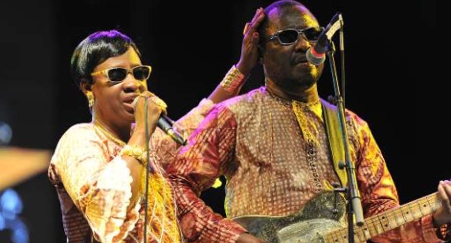 Malian musicians Amadou R and Mariam perform on stage on April 6, 2014 in Abidjan, Ivory Coast.  By Sia Kambou AFPFile