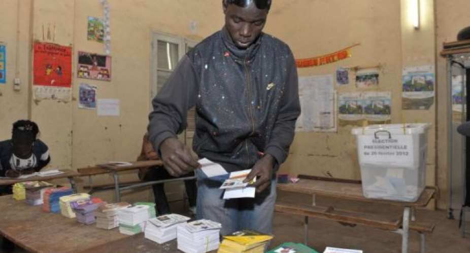 A member of the armed forces casts his ballot in Dakar ahead of presidential polls.  By Seyllou AFPFile