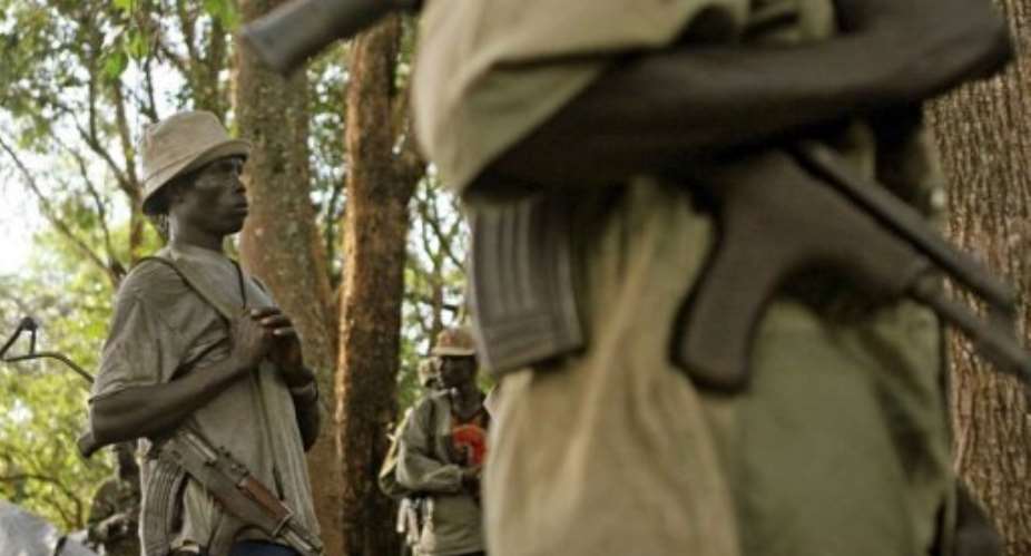 Armed fighters of the Lord's Resistance Army LRA stand guard in 2006.  By Stuart Price AFPFile