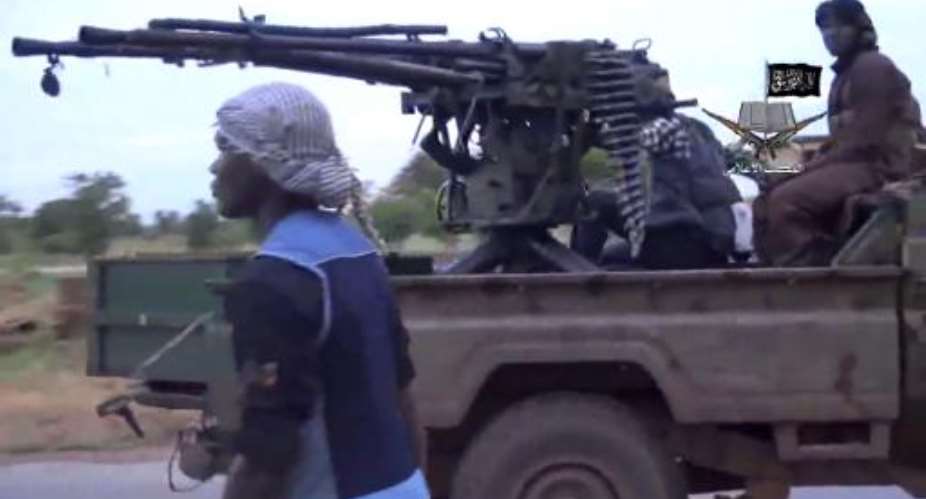 A screen-grab from a video released by Boko Haram shows alleged members of the Nigerian Islamist extremist group at an undisclosed location on August 24, 2014.  By  Boko HaramAFP