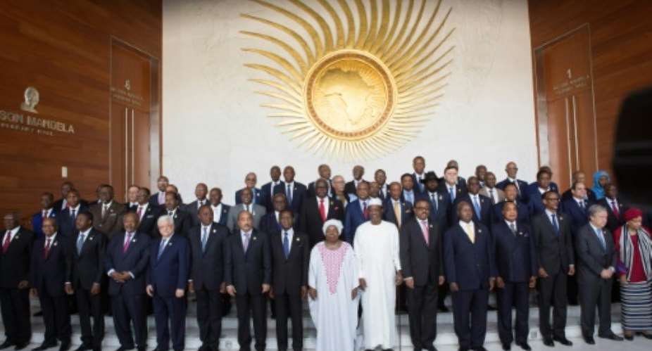 African Heads of State pose for a group photo ahead of the start of the 28th African Union summit in Addis Ababa on January 30, 2017.  By Zacharias ABUBEKER AFP