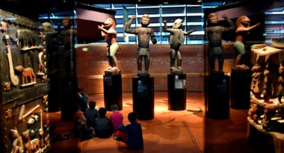 African statues, plundered by French troops in 1892 from the kingdom of Dahomey -- modern-day Benin -- are displayed in Paris Quai Branly museum.  By GERARD JULIEN (AFP)