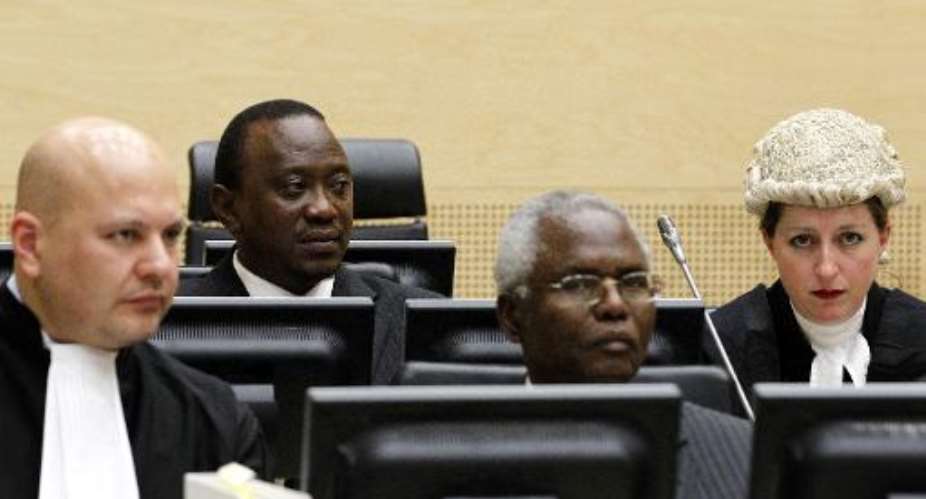 Picture taken on August 8, 2011 shows Kenya's then deputy prime minister and finance minister Uhuru Kenyatta 2ndL, and Cabinet secretary Francis Muthaura 2ndR at the International Criminal Court in The Hague.  By Bas Czerwinski PoolAFPFile