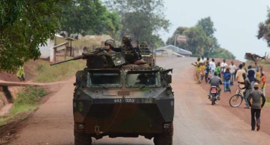 French soldiers patrol in a street in the town of Yaloke, north of Bangui, on February 2, 2014.  By Issouf Sanogo AFP