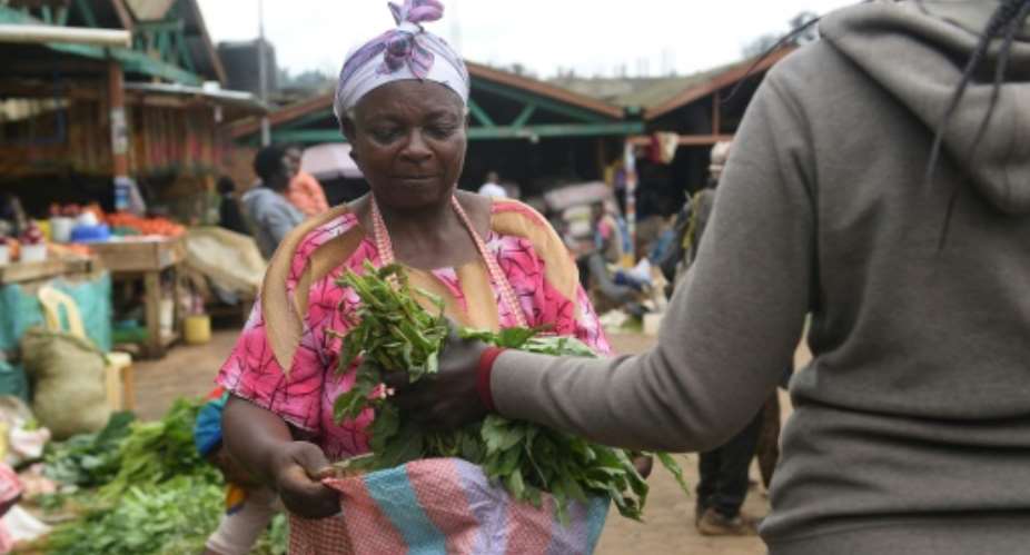 Agneta Ambane says she has been selling vegetables since she was eight.  By Simon MAINA AFP