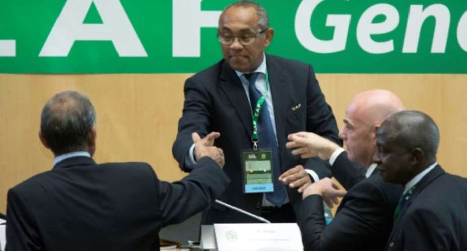Ahmad Ahmad C of Madagascar is congratulated by FIFA president Gianni Infantino 2ndR after being elected the new president of the Confederation of African Football CAF in Addis Ababa on 16 March 2017.  By Zacharias ABUBEKER AFPFile