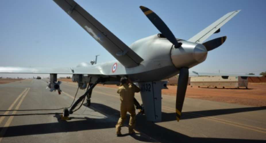 Air power: An armed Reaper drone is checked before takeoff at a French base in Niger, part of Frances Barkhane anti-jihadist force.  By Daphn BENOIT (AFP)