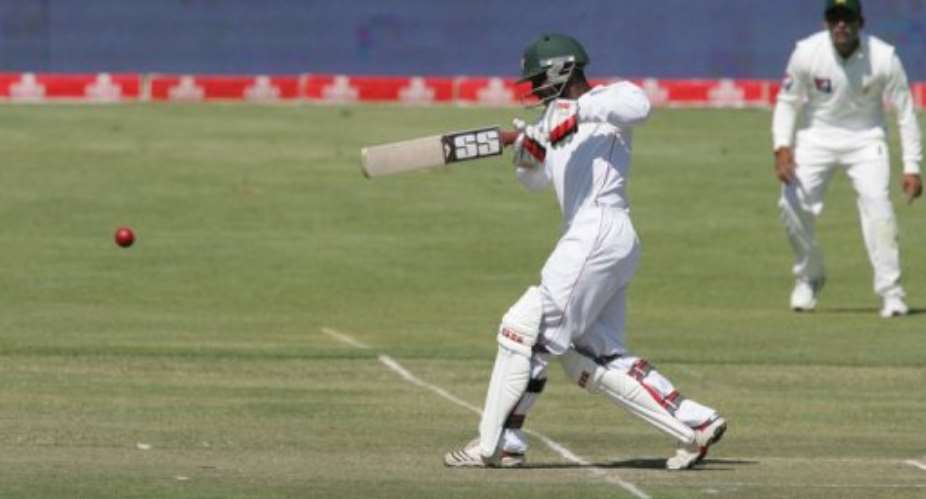 Tatenda Taibuplays a stroke for Zimbabwe in the test against Pakistan at Queens Sports Club in Bulawayo today.  By Jekesai Njikizana AFP