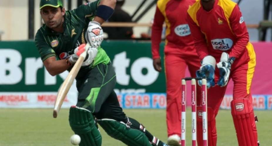 Pakistan batsman Umar Akmal L plays a shot during the second of two Twenty20 matches against Zimbabwe at Harare Sports Club on September 29, 2015.  By Jekesai Njikizana AFP