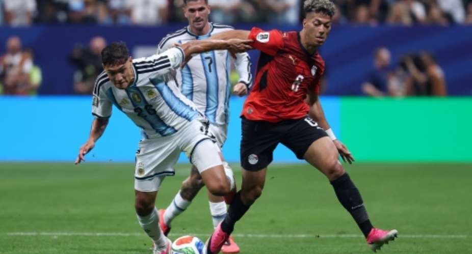 Al Ahly midfielder Emam Ashour (R) playing for Egypt against Argentina at the 2026 World Cup.  By Odd ANDERSEN (AFP)