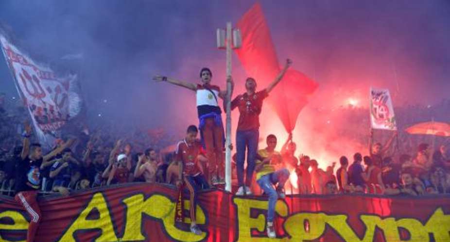 Al-Ahly Egyptian fans celebrate in Cairo on November 10, 2013.  By Khaled Desouki AFP