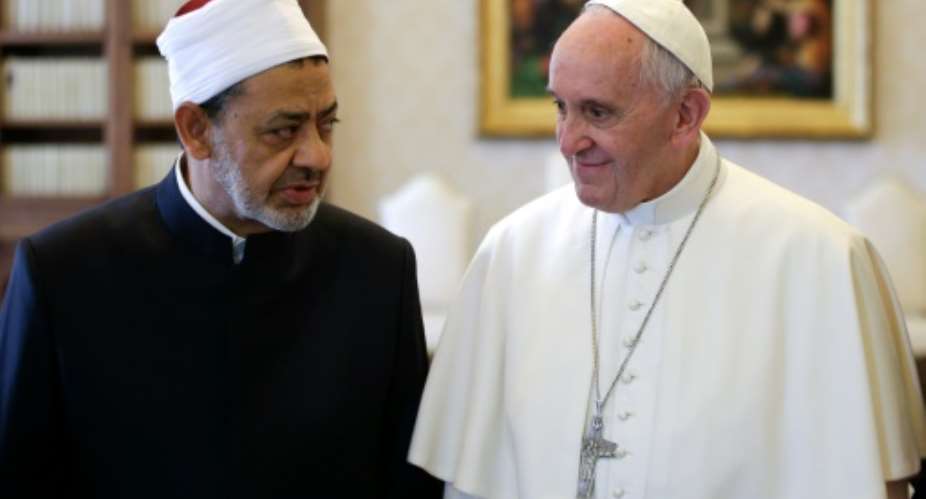 Pope Francis right talks with Al-Azhar's Grand Imam Ahmed al-Tayeb during a private audience at the Vatican, on May 23, 2016.  By Max Rossi PoolAFP
