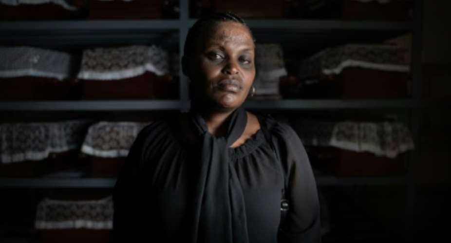 Albertine Mukakamanzi last saw her mother kneeling in prayer as men with machetes closed in.  By Simon Wohlfahrt AFP