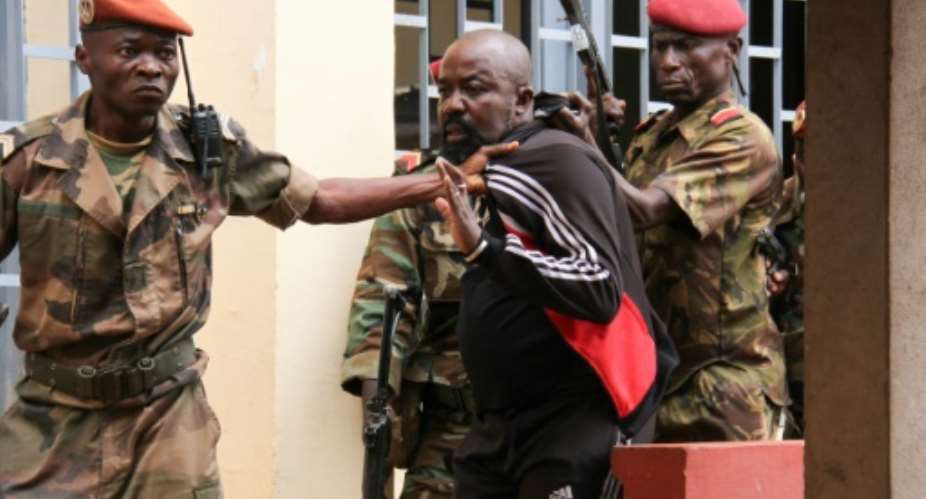Alfred Yekatom, also known as Colonel Rambo -- seen here after his arrest in October -- arrived at the ICCs detention unit over the weekend.  By Gael GRILHOT (AFP/File)
