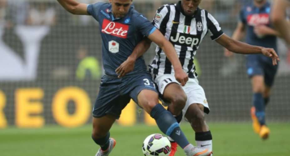 Napoli's Algerian defender Faouzi Ghoulam tackles Juventus' French midfielder Kingsley Coman in an Italian league match on May 23, 2015 in Turin.  By Marco Bertorello AFPFile