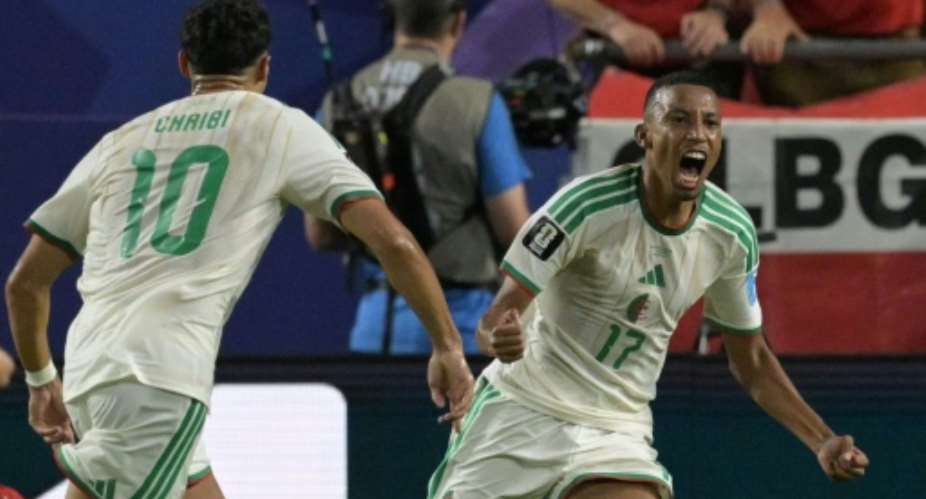 Algeria defender Rafik Belghali celebrates his teams first goal in the World Cup Group J match against Austria.  By JUAN MABROMATA (AFP)