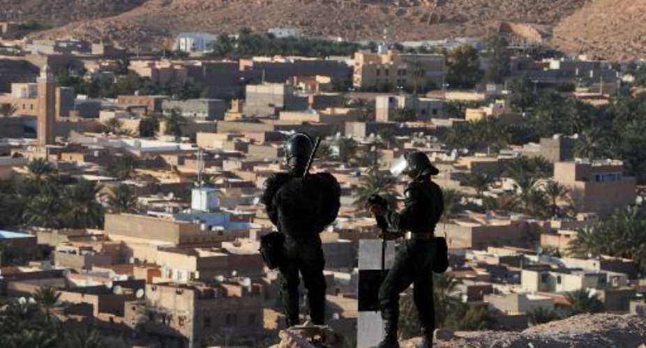 Algerian security forces stand guard on a ridge in Ghardaia on March 18, 2014.  By Farouk Batiche AFPFile