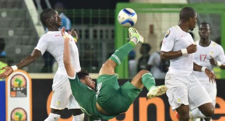 Algeria's midfielder Saphir Taider C kicks the ball during their 2015 African Cup of Nations group C football match against Senegal on January 27, 2015 in Malabo.  By Issouf Sanogo AFP