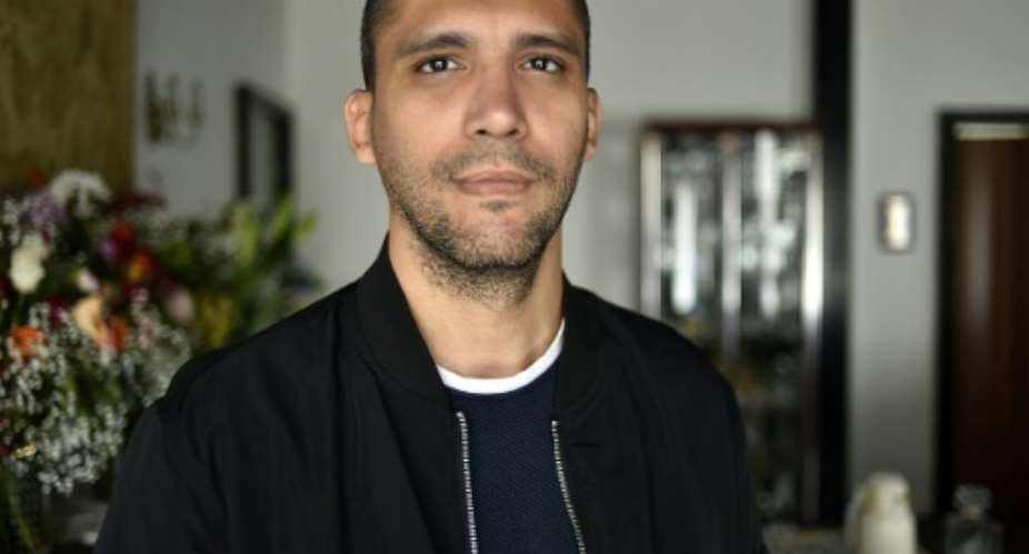 Algerian journalist Khaled Drareni, pictured in February 23, 2021.  By RYAD KRAMDI AFP