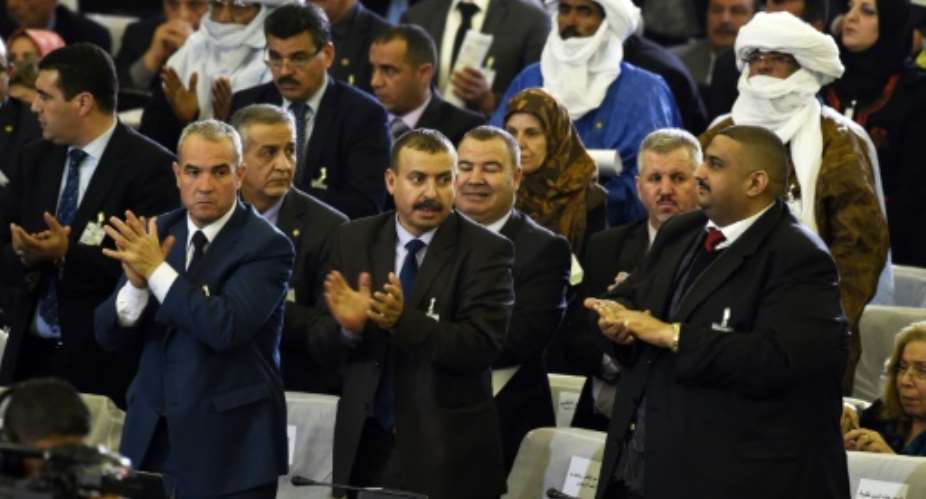Algerian parliamentary group leaders applaud during a vote on a package of constitutional reforms in the capital Algiers on February 7, 2016.  By Farouk Batiche, Farouk Batiche AFP