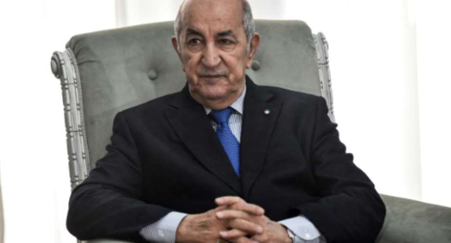 Algerian President Abdelmadjid Tebboune, here photographed in January 21, 2020, was transferred from hospital in Algiers to Germany on Wednesday.  By RYAD KRAMDI AFPFile