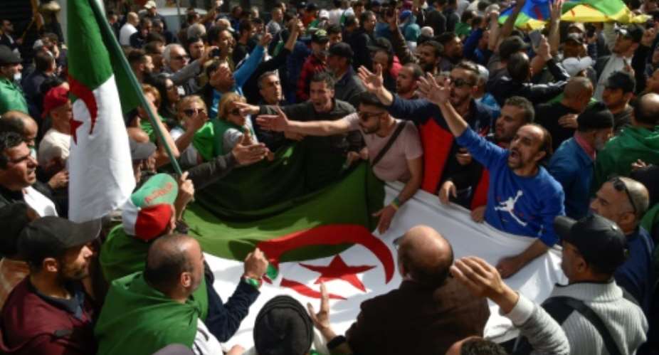 Algerian protesters gathered during a weekly anti-government demonstration in the capital Algiers on March 13 before the coronavirus outbreak halted such rallies.  By RYAD KRAMDI AFPFile
