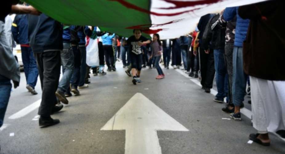 Algerian protesters have demanded sweeping reforms ahead of a December presidential vote.  By RYAD KRAMDI AFPFile