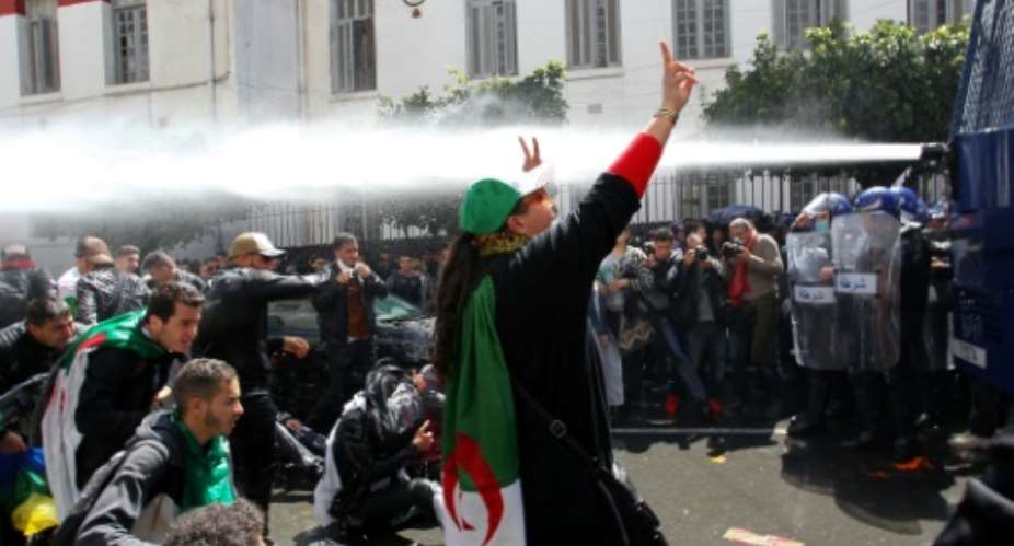 Algerian security forces used water cannon against students protesting in Algiers.  By STRINGER AFP
