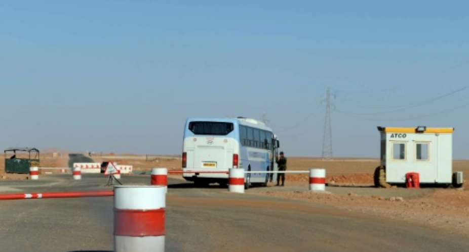Algerian soldiers man a checkpoint near In Amenas in the Sahara.  By Farouk Batiche AFP
