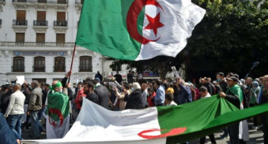 Algerians march during a demonstration in the capital on March 19, 2021.  By RYAD KRAMDI AFPFile