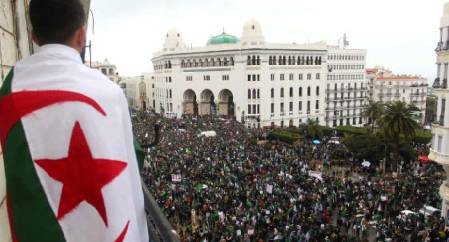 Algerians mass again on the streets of the capital demanding ailing President Abdelaziz Bouteflika step down.  By - AFP