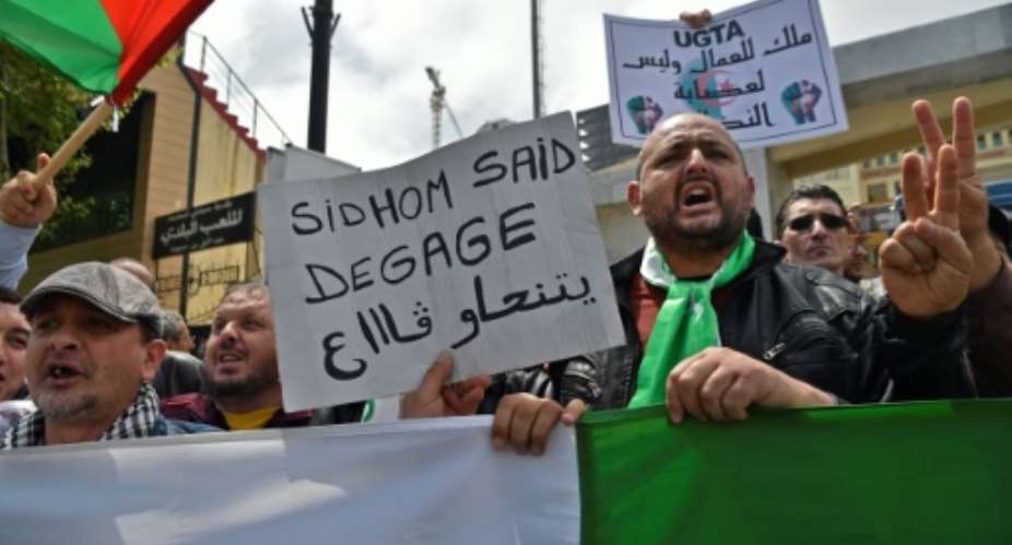 Algerians rallied Wednesday outside the powerful General Union of Algerian Workers UGTA headquarters.  By RYAD KRAMDI AFP