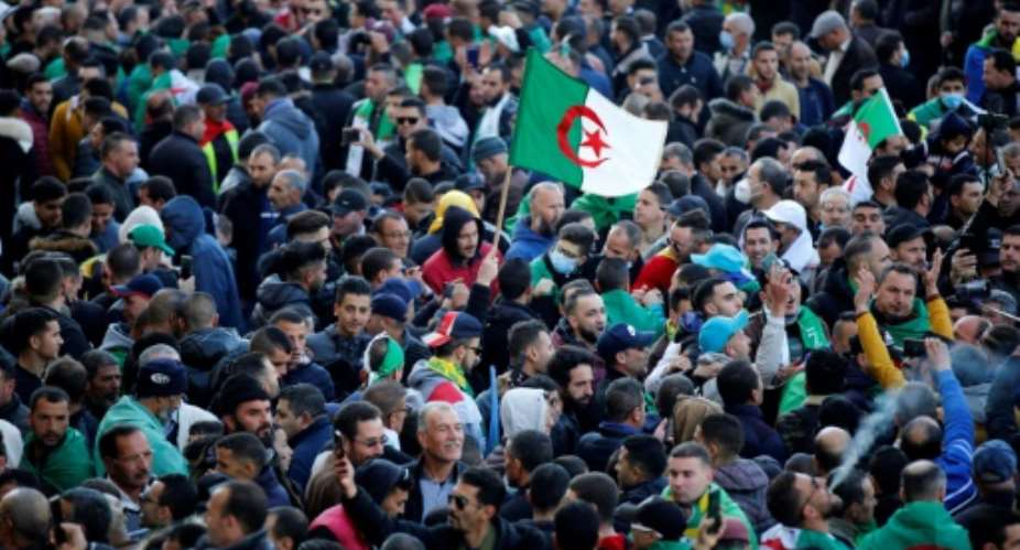 Algerians rally on Tuesday marking the start of Hirak protests two years earlier.  By - AFP